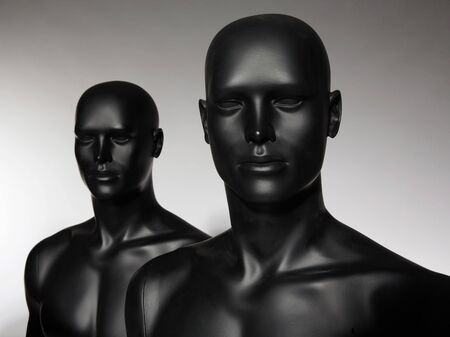 two mannequins standing alone on grey backgroundの写真素材