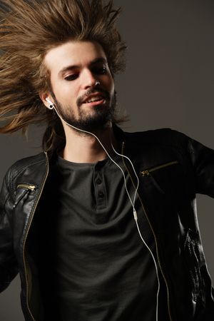 Jumping man with mad faceの写真素材