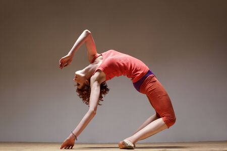 modern style dancer posing on studio background