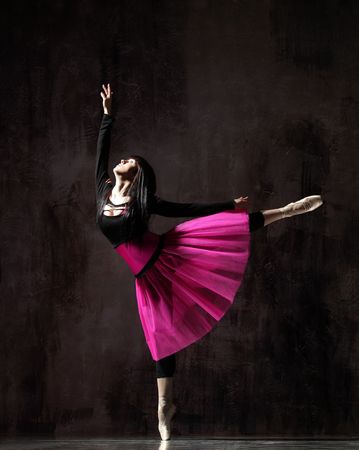 modern style dancer posing on dirty grunge backgroundの写真素材