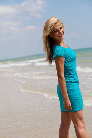 beautiful woman posing on the sea beachの写真素材