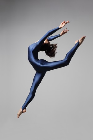 modern style dancer posing on studio backgroundの写真素材
