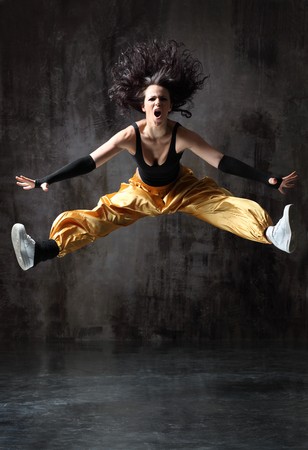 modern style dancer posing on studio backgroundの写真素材