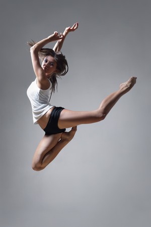 modern style dancer posing on studio backgroundの写真素材