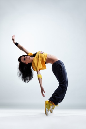 modern style dancer posing on studio backgroundの写真素材