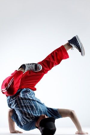 young beautiful dancer posing on a studio backgroundの写真素材