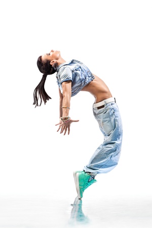 young beautiful dancer posing on a studio backgroundの写真素材