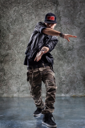 cool looking and stylishly dressed dancer posingの写真素材
