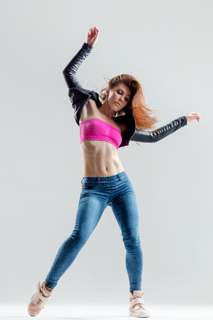 young and beautiful modern style dancer posingの写真素材