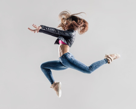 young and beautiful modern style dancer posingの写真素材