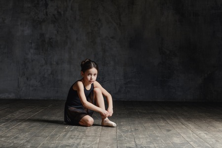 Ballerina girl posing in dance studioの写真素材