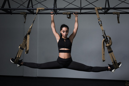 Sporty woman doing  exercises in the gym