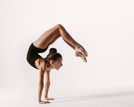 Young gymnast girl stretching and trainingの写真素材