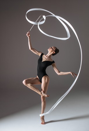 Young gymnast woman stretching and trainingの写真素材