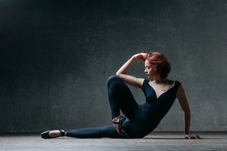Young beautiful ballerina posing in studioの写真素材
