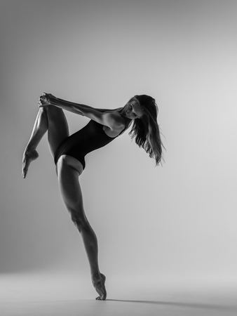 Young gymnast woman stretching and trainingの写真素材