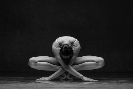 Young beautiful athlete is posing in studioの写真素材