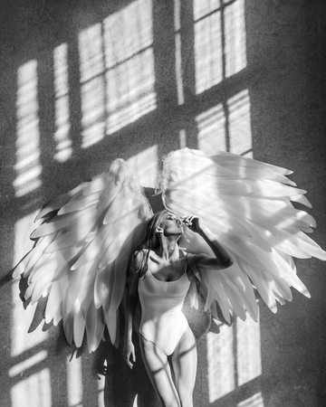 angel woman posing in studioの写真素材