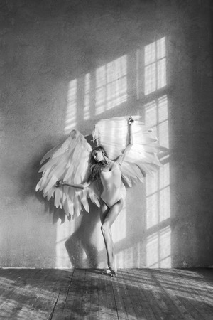 angel woman posing in studioの写真素材