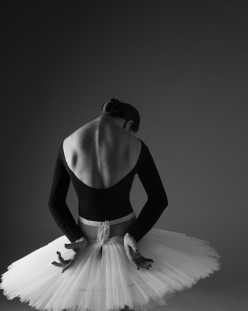 Young beautiful ballerina is posing in studioの写真素材