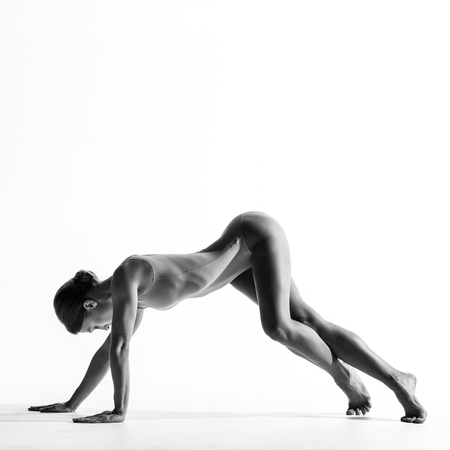 Young beautiful athlete is posing in studioの写真素材