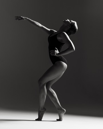 Young beautiful athlete is posing in studioの写真素材