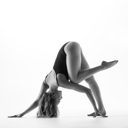 Young beautiful athlete is posing in studio