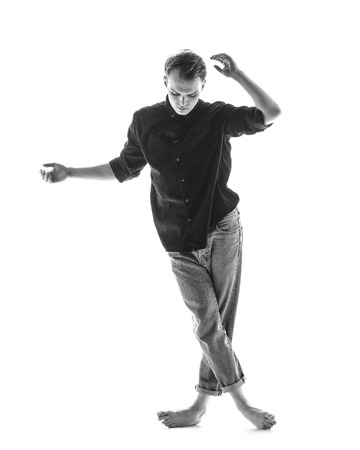 Young beautiful dancer is posing in studioの写真素材