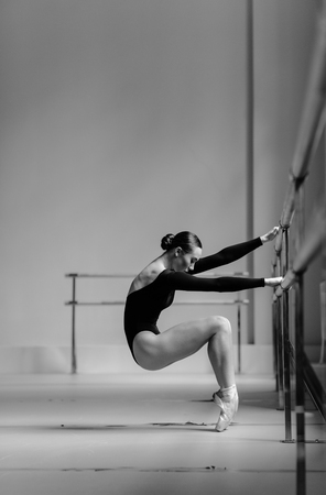 Beautiful ballerina training in the classの写真素材