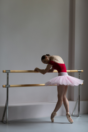 Beautiful ballerina training in the classの写真素材