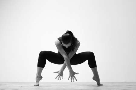 beautiful dancer posing on a studio background