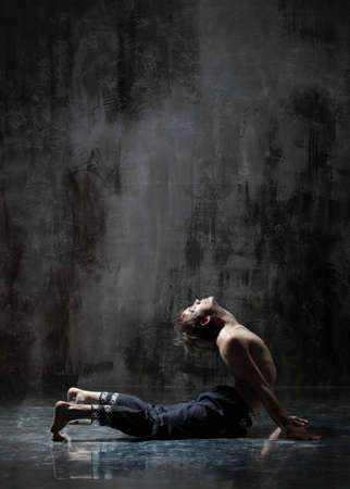 Beautiful yoga doing exercises in studioの写真素材