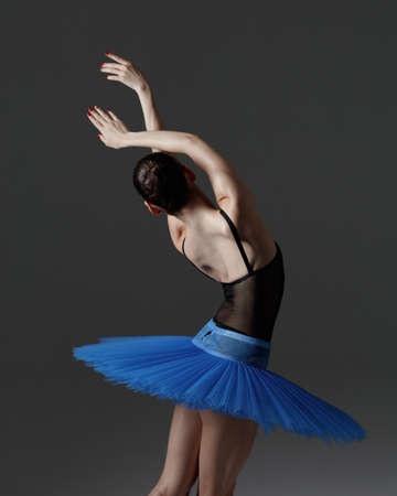 Young beautiful ballerina is posing in studioの写真素材