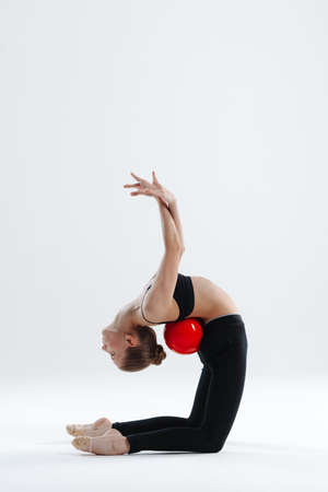 Young gymnast girl stretching and trainingの写真素材