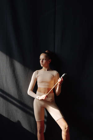 Young gymnast girl stretching and training