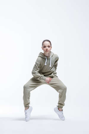 Young beautiful cool looking girl posing in studioの写真素材