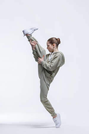 Young beautiful cool looking girl posing in studioの写真素材