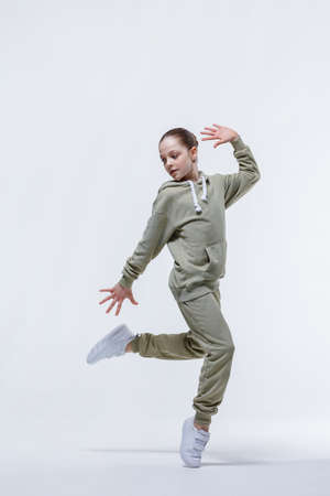 Young beautiful cool looking girl posing in studioの写真素材