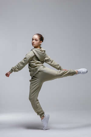 Young beautiful cool looking girl posing in studioの写真素材