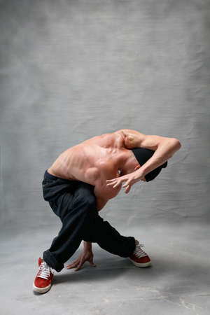 Young beautiful cool looking bboy posing in studio