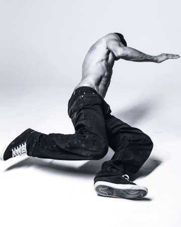 Young beautiful cool looking bboy posing in studio
