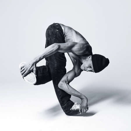 Young beautiful cool looking bboy posing in studio