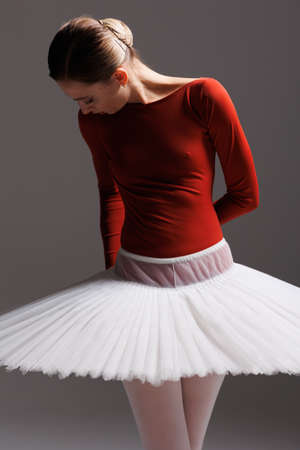 young beautiful ballet dancer posing in a studioの写真素材