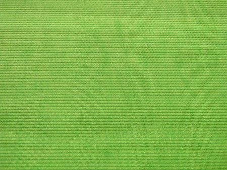 Elevate your design projects with this high-resolution image of a vibrant green woven fabric, featuring a distinctive corrugated texture with raised parallel ridges. The tight weavの写真素材