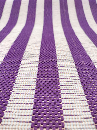 Elevate your designs with this exquisite white and purple striped fabric texture, showcasing a...