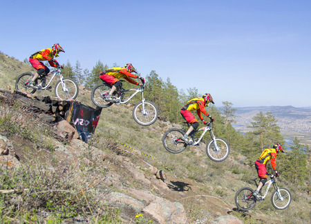 Ulan-Ude, Russia - April 27: an unidentified rider jumps from a ramp on the competitions for the "Cup of Buryatia on a Mountain Bike" on 27 April 2014 in Ulan-Ude, Russia. Serial shooting.のeditorial素材