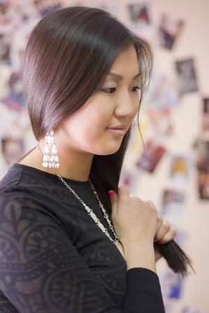 Beautiful  Chinese girl wears a national Yakut ornaments of silver.の写真素材