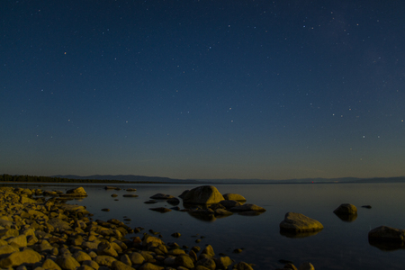 Bright stars shining over the great lake Baikal.の写真素材