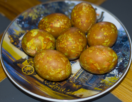 Chicken eggs are painted for Easter. The eggs in the coloring acquired a marble coloring.の写真素材