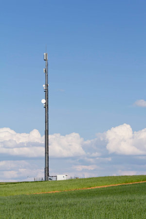 communications tower in the field and skyの写真素材